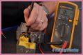How do you test a Honeywell gas valve with a multimeter?